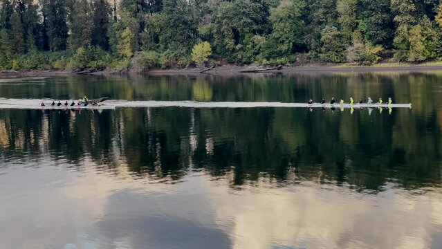 Skulling crew rowing on a river