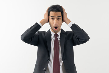 Young businessman in shock facial expression isolated on background