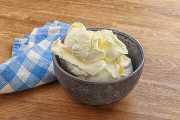 Italian soft mascarpone cheese in the bowl