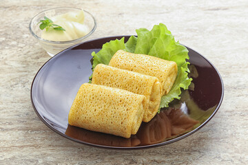 Stuffed pancakes with meat and cream