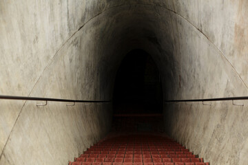 A long tunnel down into a dark dungeon