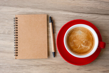 blank notebook and coffee cup on wood table. Motivation, Resolution, To do list, Strategy and Plan concept