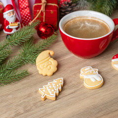Merry Christmas with homemade cookies and coffee cup on wood table background. Xmas eve, party, holiday and happy New Year concept