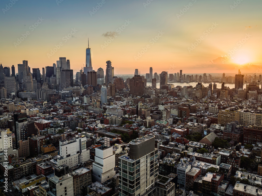 Canvas Prints Sunset above New York Lower Manhattan buildings at summer. Warm Late afternoon light behind the clouds