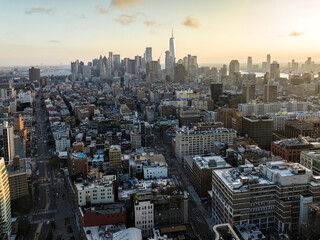 Fototapeta na wymiar Sunset above New York Lower Manhattan buildings at summer. Warm Late afternoon sunlight