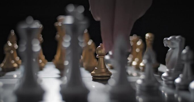 Strategic chess move - gold pawn takes opponent's silver pawn, shallow focus arc