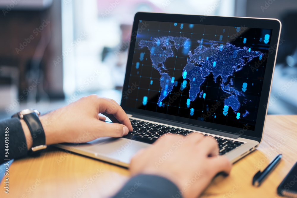 Poster Close up of hands at workpace using laptop with abstract glowing map hologram on screen. Office background. Digital world, transformation and future cyber space concept.