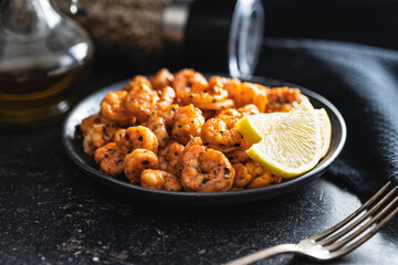 Grilled tiger shrimps on plate.
