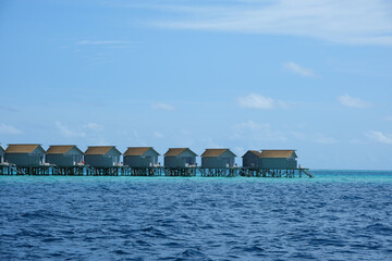 Beautiful baa atoll with tropical stilts house near Male, Maldives.