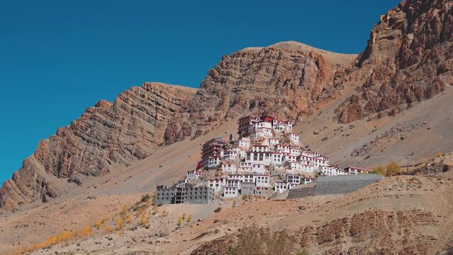 4K shot of Key Monastery in front of the mountains near Kaza at Spiti Valley in Himachal Pradesh, India. View of the largest buddhist monastery in Lahaul and Spiti district in India. 