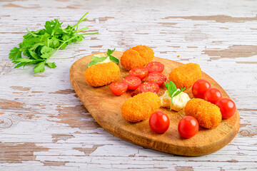 croquettes with cherry tomatoes