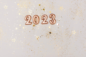 happy new year 2023 background new year holidays card with bright lights,gifts and bottle of...