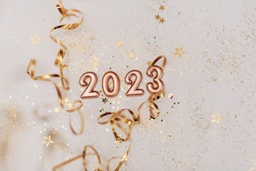 happy new year 2023 background new year holidays card with bright lights,gifts and bottle of hampagne