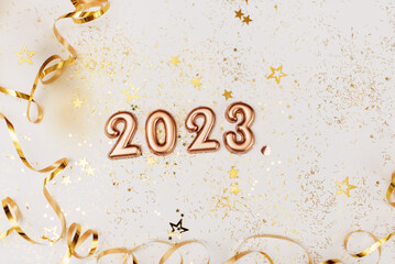 happy new year 2023 background new year holidays card with bright lights,gifts and bottle of...