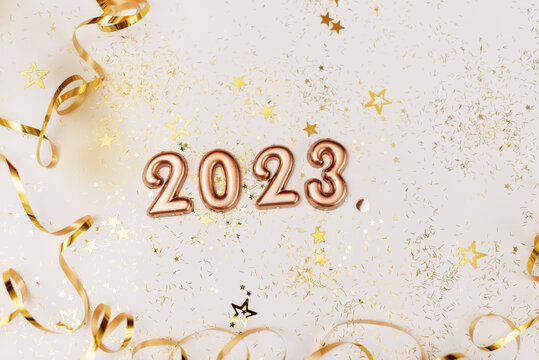happy new year 2023 background new year holidays card with bright lights,gifts and bottle of hampagne
