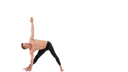 Young attractive man stretches before training.