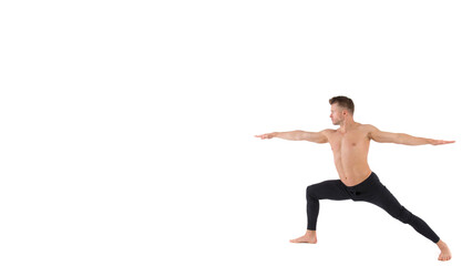 Young attractive man stretches before training.