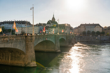 Switzerland, Basel-Stadt, Basel, Sun shining over historic Middle Bridge