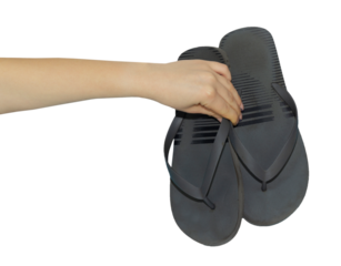 old flip flops in hand, concept to pass or throw away shoes