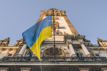 Germany, Hamburg, Ukrainian flag hanging onHamburg City Hall