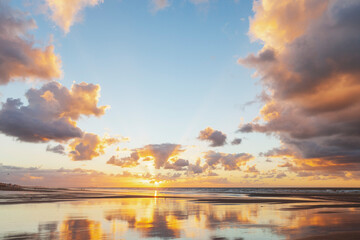 Belgium, West Flanders, Wet beachat moody sunset
