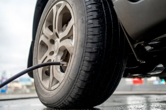 Car Tire Inflated Through Air Pump