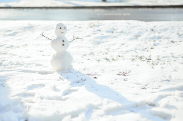 Little snowman winter. the snow melts