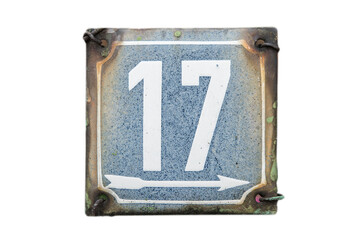 Weathered grunge square metal enameled plate of number of street address with number 17 isolated on...