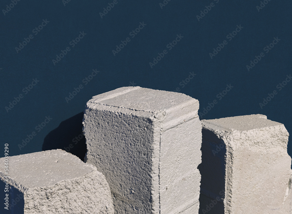 Poster old stone blocks in row against dark blue background. 3d computer graphic template of displaying pla