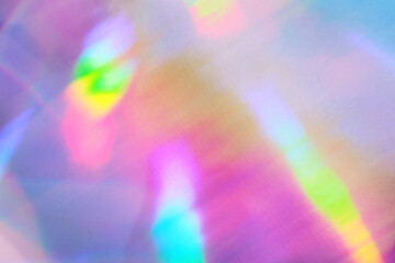 Iridescent holographic textural Background. Metallic paper or foil with iridescent highlights