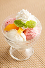 ice cream with orange and whipped cream