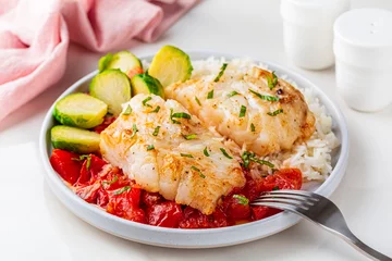 Poster Baked cod fish, with tomato, brussel sprouts and boiled rice. Balanced food concept. © Olga