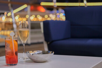Champagne sparkling wine and cocktail longdrink on outdoor patio terrace deck of luxury cruiseship...