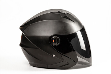 Black helmet of a motorcyclist with a visor on a white background.