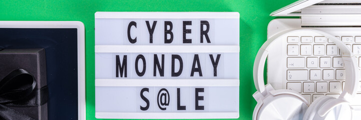 Cyber monday sale background. Simple bright green flat lay with lightbox 