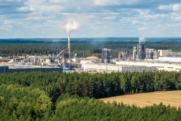 aerial panoramic view on smoke of pipes of chemical or wooden enterprise plant. Industrial landscape environmental pollution waste plant. Air pollution concept.