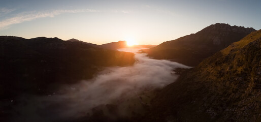 Watching the sunrise above the mist that forms between the mountains