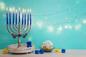Religion image of jewish holiday Hanukkah background with menorah (traditional candelabra),...