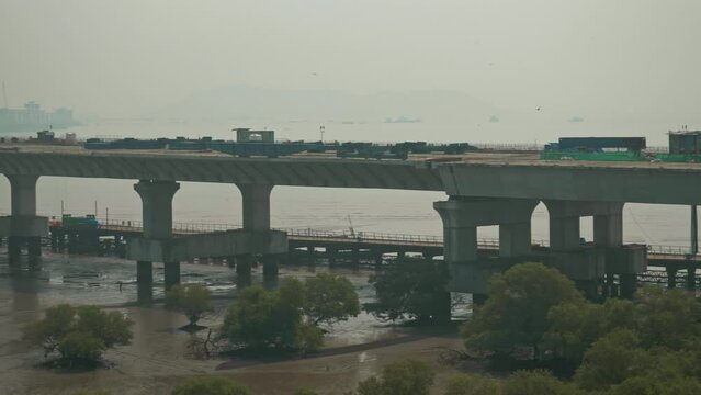 Pan left shot of ongoing construction site of Mumbai coastal road project, 29.2-km long freeway from Mumbai's western coastline connecting Marine Lines in the south to Kandivali in the north
