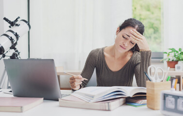 Frustrated student studying at home