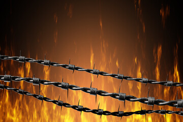Prickly fence. Flames behind barbed wire. Spiked wire to prevent entry. Background with burning...