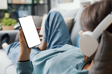 Woman relaxing on the couch and connecting online
