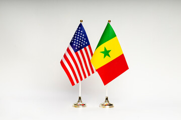 State flags of the USA and Senegal on a light background.