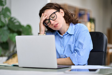 Stressed tired depressed young professional business woman employee touching head feeling headache...