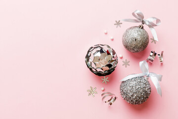 Christmas ball on colored background. decoration bauble with ribbon bow with copy space