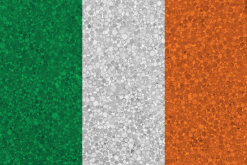 Fototapeta premium Flag of Ireland on styrofoam texture. national flag painted on the surface of plastic foam