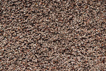 Top view of brown small stones  textured rough background.
