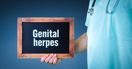 Genital herpes (herpes simplex virus). Doctor shows sign/board with wooden frame. Background blue - obrazy, fototapety, plakaty