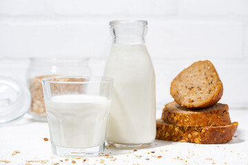 fresh milk and whole grain bread slices, closeup