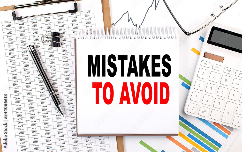 Aufkleber mistakes to avoid text on notebook with chart, calculator and pen